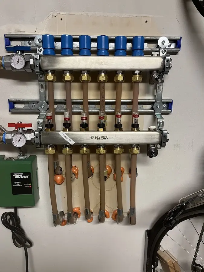 Plumber performing Water Heater Repair at a residential property in Zachary